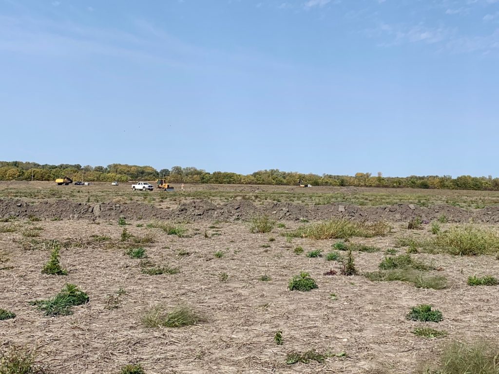 Nature Conservancy Canada Wetland Restoration Project on Pelee Island large open farm field with trucks.