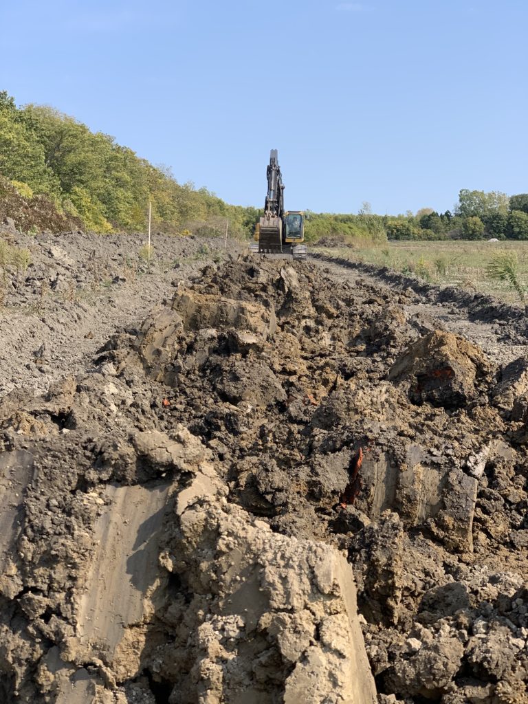 Nature Conservancy Canada Wetland Restoration Project on Pelee Island digging clay berm