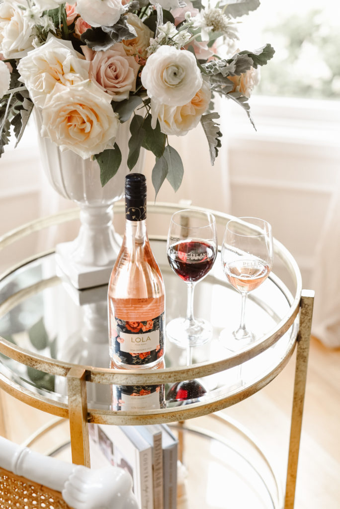 Vase of roses with Pelee Island Winery LOLA Blush Sparkling Rosé VQA wine at The Leslie Style Vacation home in spring in Kingsville. 